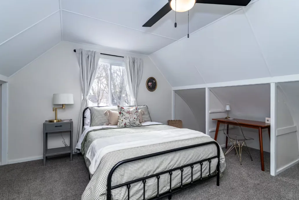 Calm furnished bedroom set up for a monthly stay — mid term rental property management