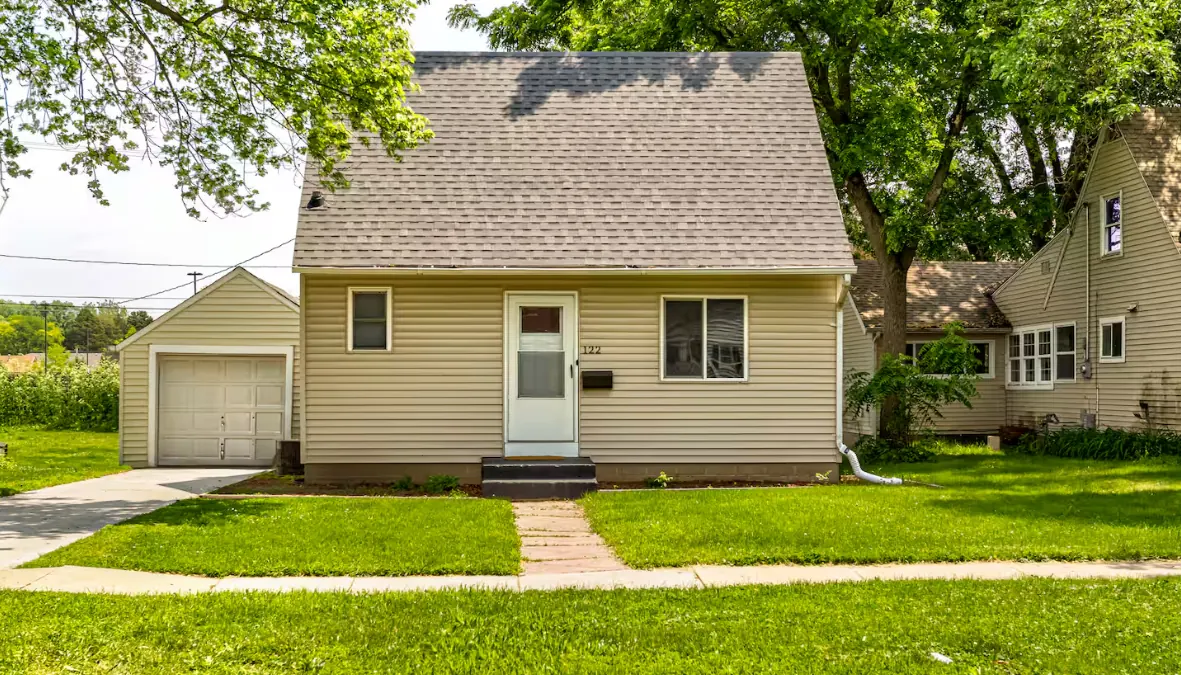 Well-kept short-term rental home exterior in Central Iowa — managing short term rentals